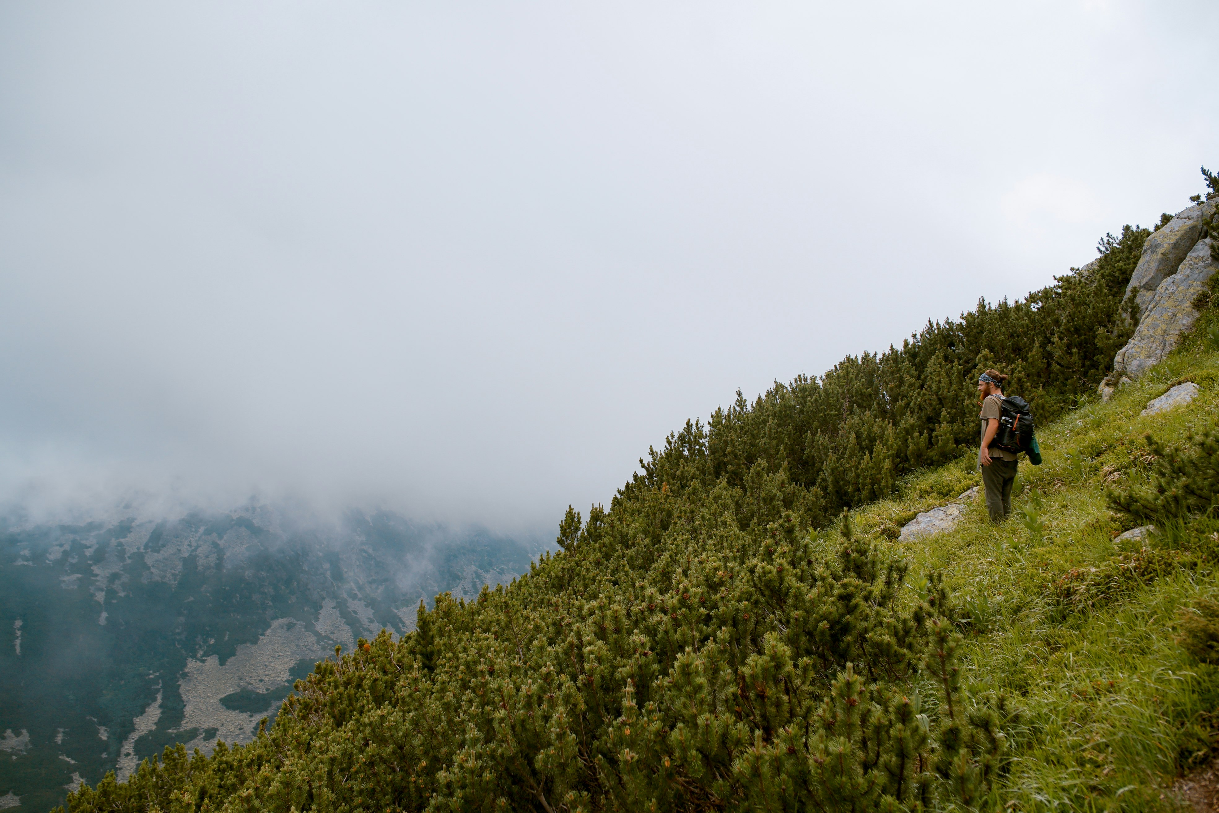 person standing on top of mountain